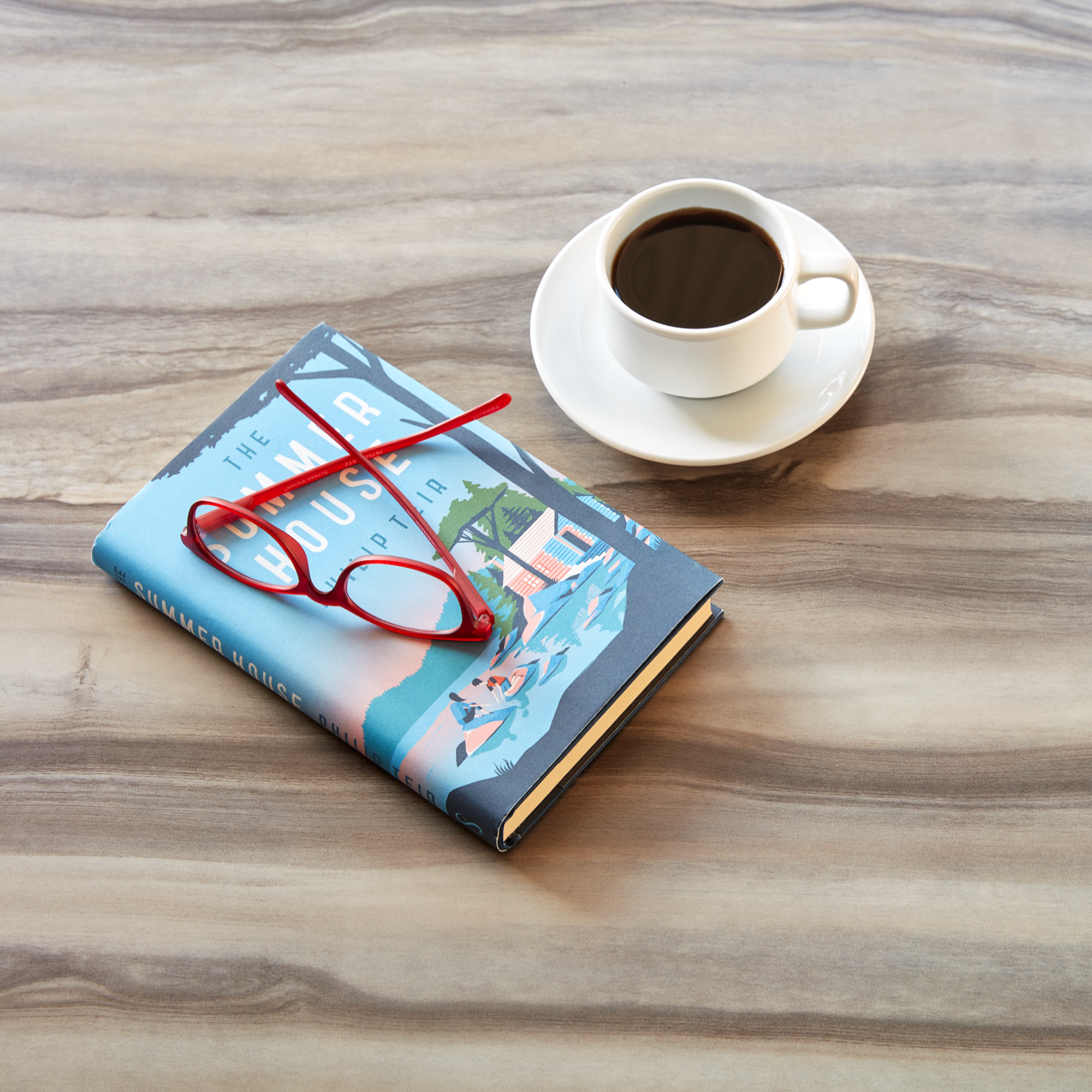 Formica® Living Impressions™ Residental Laminate Collection countertop with book and coffee